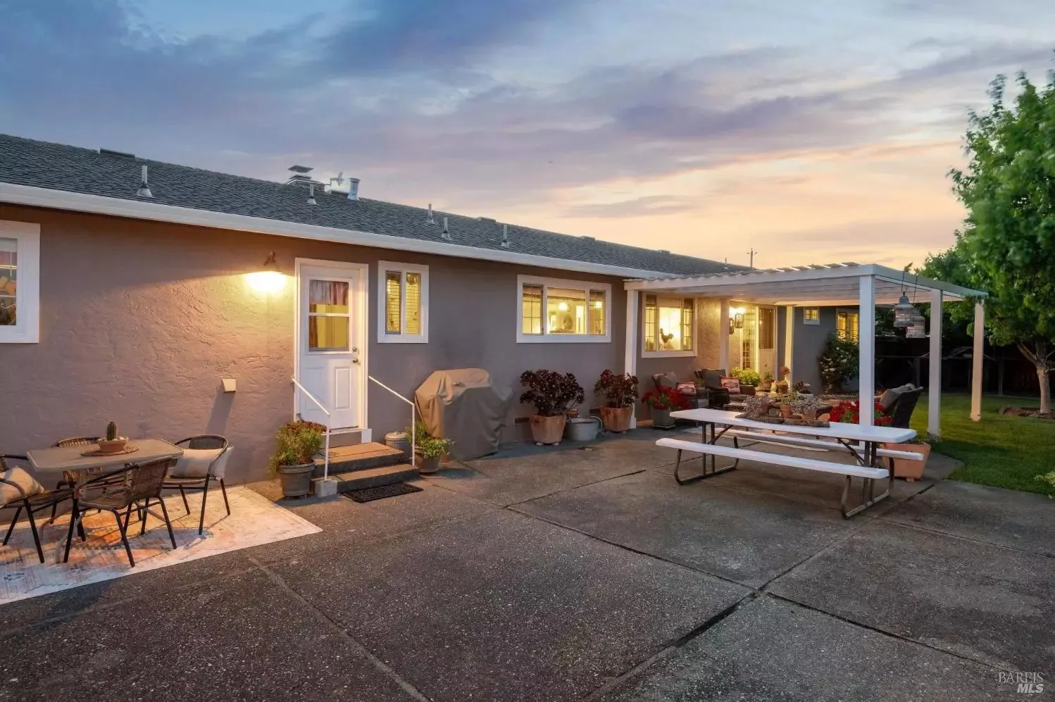 Back patio and outdoor entertaining spaces at dusk
