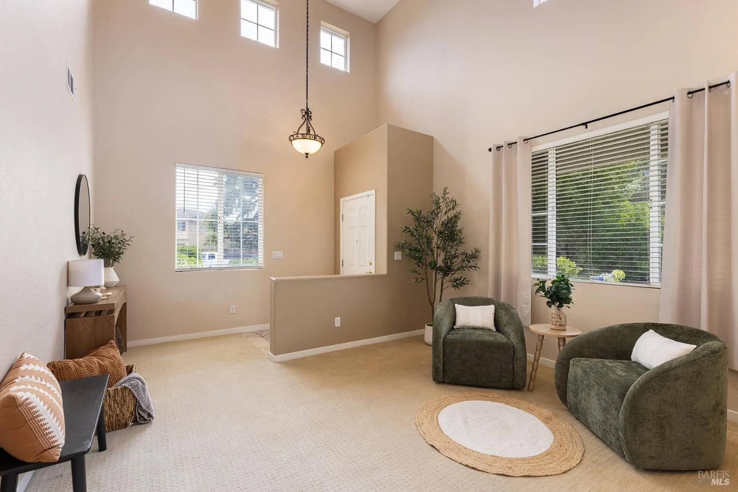 Vaulted living area with seating near the entry